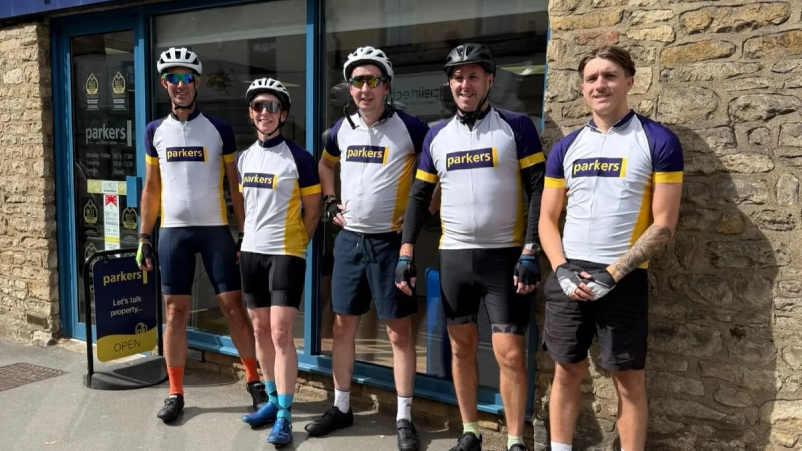 Cyclists from a West Oxfordshire estate agent Parkers Properties outside the Parkers Witney office
