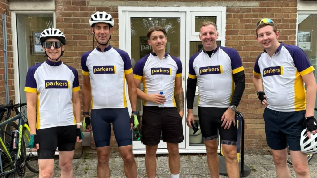Cyclists from a West Oxfordshire estate agent Parkers Properties outside the Parkers Eynsham office