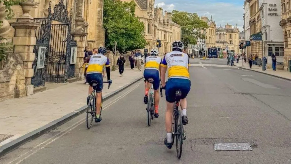 Cyclists from a West Oxfordshire estate agent Parkers Properties riding through Oxford on the Tour de Parkers