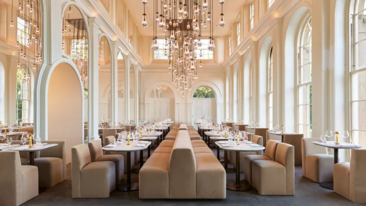 The Orangery by RH England at Aynho Park offers a dramatic live-fire dining experience in a luminous setting with abundant natural light